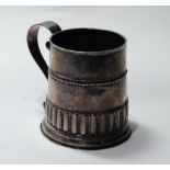 Silver mug of tapering shape with embossed flutes and bands, initialled and dated, 1703,