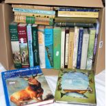 Box of fishing and game hunting related books.