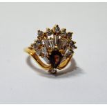 Dress ring with a hessonite garnet with a fan of baguette and brilliant white sapphires, in gold,