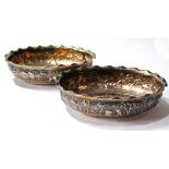 Pair of Indian silver oval bowls embossed with typical scenes, by Dass & Dutt, 13.5cm, 7oz.