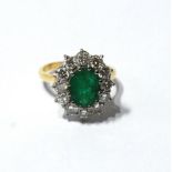 Diamond and emerald cluster ring with twelve brilliants, each approximately .1ct, '18ct'.