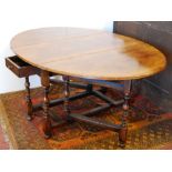 Titchmarsh & Goodwin style 20th century oak oval gate-leg table fitted with a drawer.
