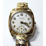 Gent's Longines 9ct gold watch of cushion shape with enamel dial, 1942.