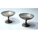 Pair of silver tazze, pierced with lozenges on moulded circular bases, by Zimmermans,