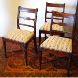 Three George III mahogany dining chairs.