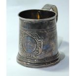Silver mug of tapering shape with reeded bands and embossed cartouche, initialled and dated 1710,