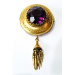 Victorian gold circular boss brooch with amethyst paste.