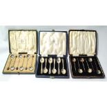 Two sets of six silver coffee spoons with bean ends and another six, cased.