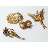 Gold flower brooch, two others and a pair of earrings, all 9ct.