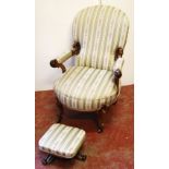 Victorian walnut open armchair with striped upholstery, 98cm high, and a footstool, 17cm high.