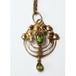 Edwardian gold pendant in the manner of Charles Rennie Mackintosh with loops and leafage about an