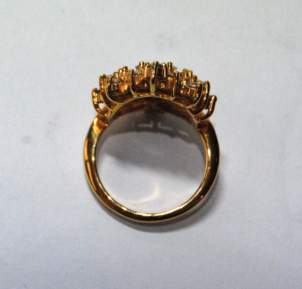 Dress ring with a hessonite garnet with a fan of baguette and brilliant white sapphires, in gold, - Image 2 of 3