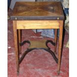 Edwardian inlaid rosewood envelope card table on square tapered supports united by an undershelf,