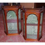 Pair of mahogany wall cabinets with pierced gallery and tracery decorated panels.