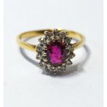 Cluster ring with an oval ruby and mixed-cut diamonds, in 18ct gold.