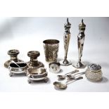 Indian silver embossed beaker, various spoons, condiments and other items.