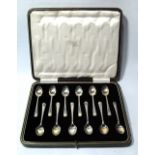 Set of twelve silver coffee spoons with bright-cut edges, Sheffield 1926, cased.