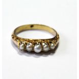 Victorian five-stone natural pearl ring in an open scroll setting, the shank unmarked.