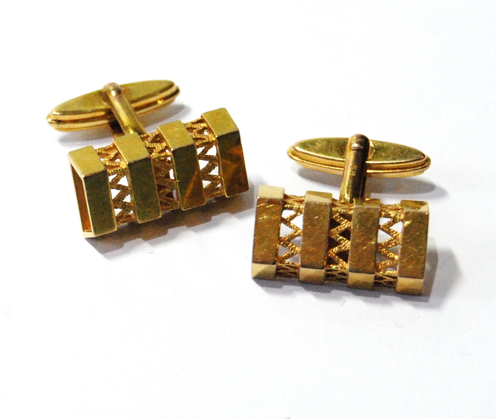 Pair of 9ct gold swivel cufflinks of pierced angular shape. Condition Report 8.