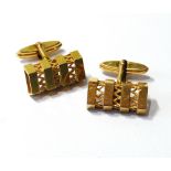 Pair of 9ct gold swivel cufflinks of pierced angular shape. Condition Report 8.