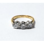 Diamond three-stone ring with brilliants, approximately .4ct and .3ct, '18ct plat'.