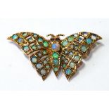 9ct gold butterfly brooch with opals and garnets. Condition Report 4.6g.