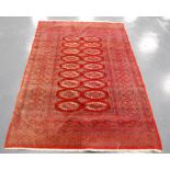 Modern Bokhara rug with two rows of guls within a wide multiple border, 188cm x 128cm.