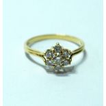 Diamond seven-stone cluster ring with brilliants, in gold, '750'.