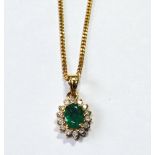 18ct gold diamond and emerald cluster pendant necklace with small curb link chain, '750, 23cm long.