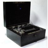 Coromandel dressing case with eight silver-mounted items, 1856.