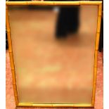 Bamboo framed wall mirror. Condition Report In good condition, 99cm x 75cm.
