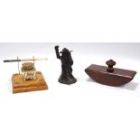 Bronzed figural inkwell, 12cm high, rolling blotter and an oak inkstand, 10cm long.