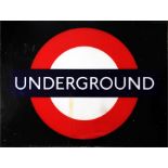 A perspex "Underground" bullseye sign, red circle with blue bar, designed to be back-lit and