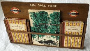 1950s London Transport wooden DISPLAY RACK lettered 'On Sale here' with two small LT bullseyes of