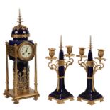 Art Deco Style, clock garniture: clock and candelabra pair, gilt metal, cobalt glazed porcelain,