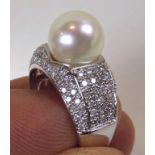 14K Diamond and Pearl Ring 14K white gold ring with round 9.7mm pearl and 100 round accent diamonds,