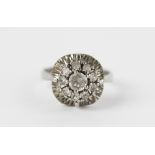 A white stone set circular cluster ring,