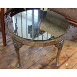 A walnut circular occasional table, with removable glass top, on shell carved cabriole legs,