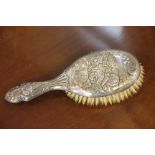 A silver backed dressing table brush, Henry Williamson Ltd, Birmingham 1939, embossed to the back