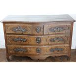 A late 18th century North European oak commode, of bombe form,