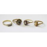 Four gold dress rings, to include, a three stone diamond ring,