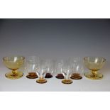 A set of six Art Deco amber and clear glass whisky glasses,