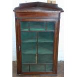 An Edwardian inlaid mahogany hanging corner cabinet, with astragal glazed doors,