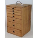 A small pine collectors cabinet of seven graduated drawers, 40cm H x 25cm W x 25.