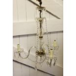 A French glass three branch ceiling light, with baluster column and glass lustre drops,