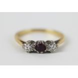 A ruby and diamond three stone ring,