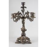 A silver plated four branch candelabra, cast with fruiting vines on a pierced scroll base, 66.
