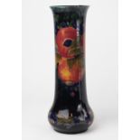 A Moorcroft Pomegranate pattern vase, with flared rim and bulbous base,