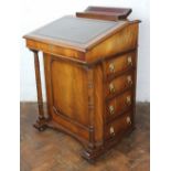 A reproduction mahogany Davenport, with leather inset slope above four side drawers,