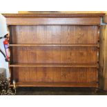 An oak hanging three tier plate rack with dentil cornice,